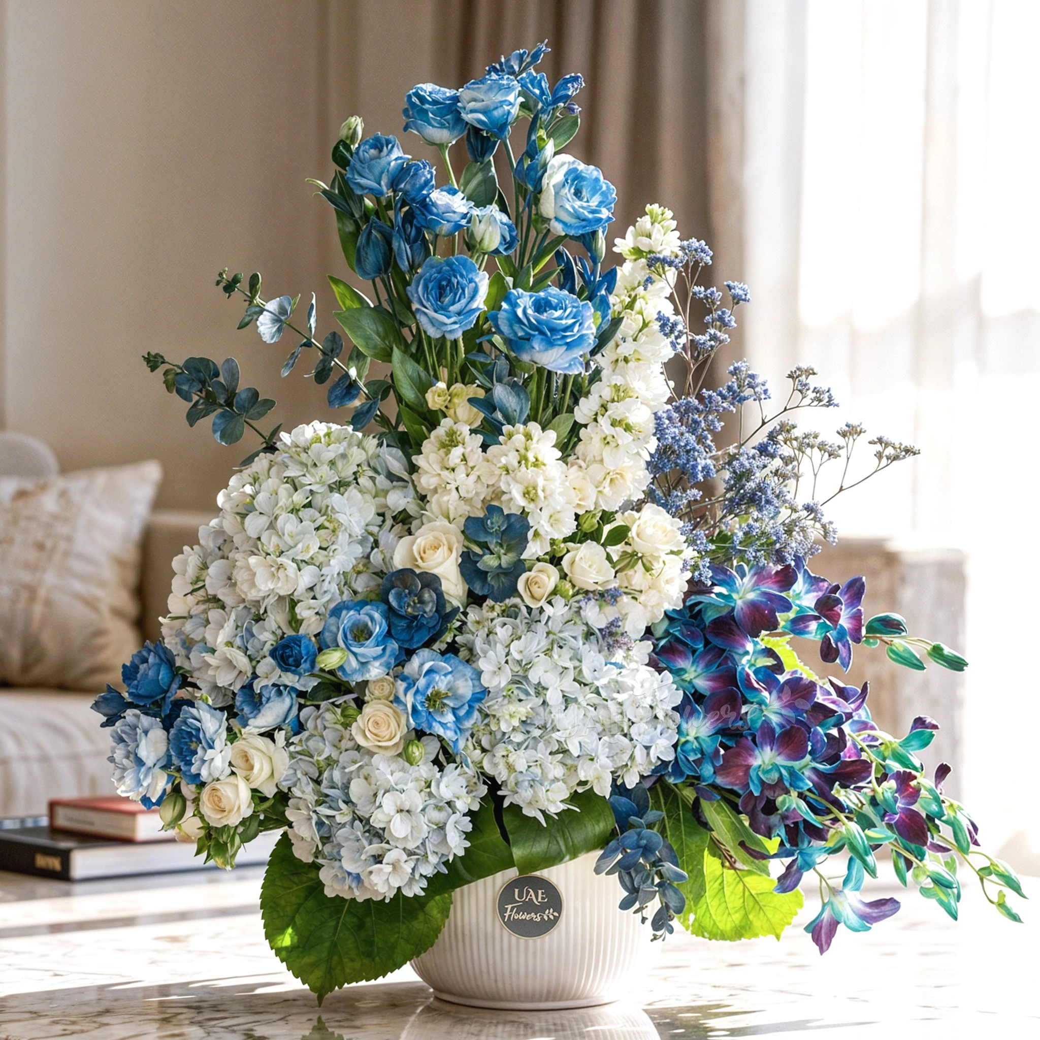 Serene ceramic pot arrangement of white blooms and blue orchids, hydrangeas, and fillers