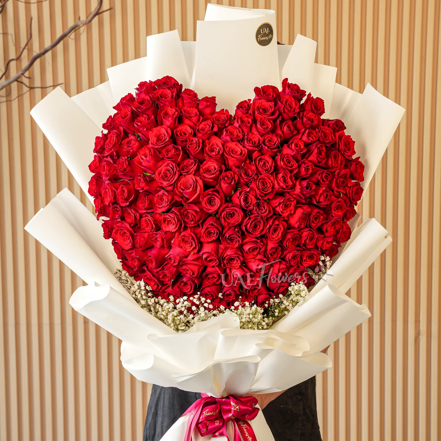 150 red roses with baby’s breath fillers, wrapped in elegant paper