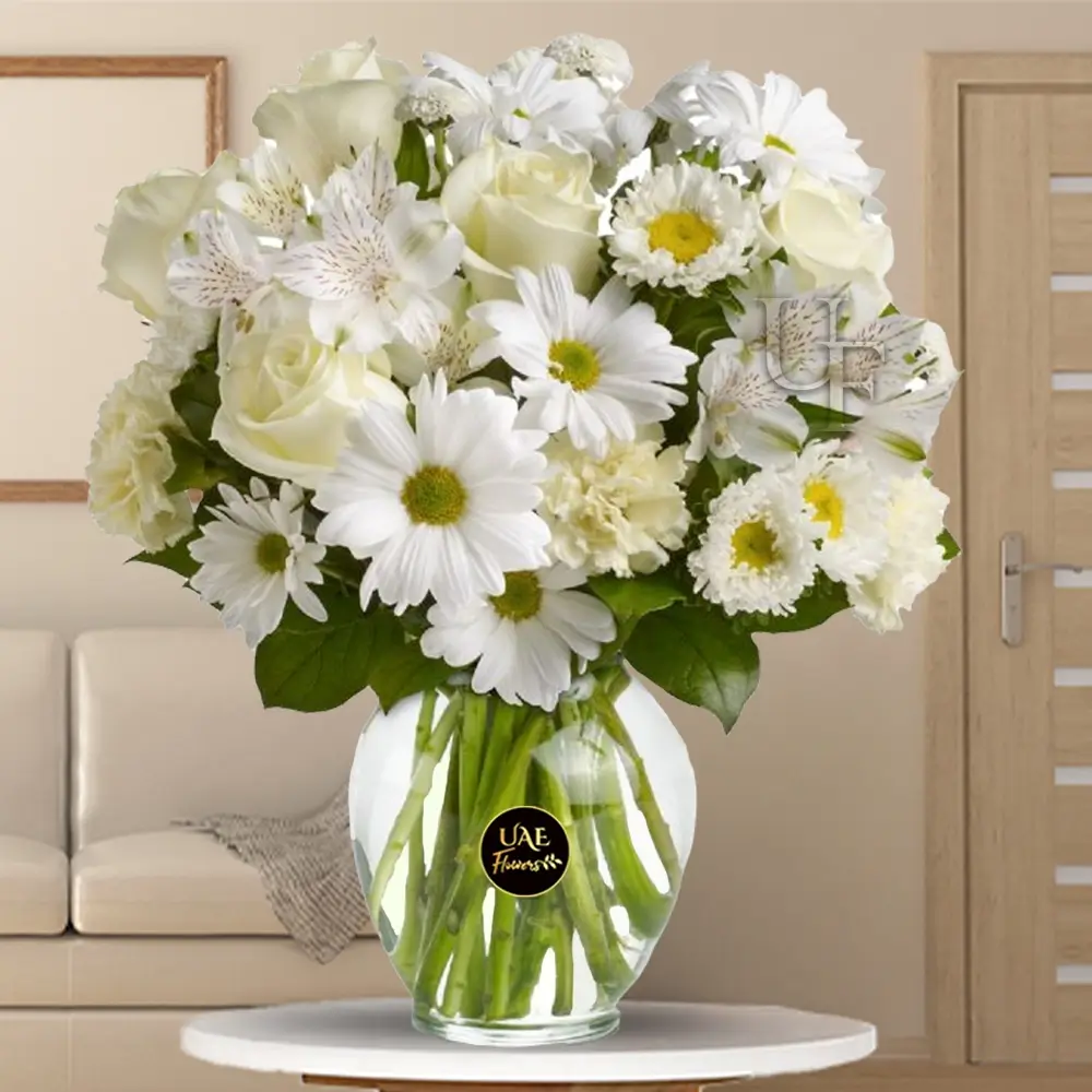 5 white rose, 5 white carnation, 3 white alstroemeria, and 3 white chrysanthemums in a vase