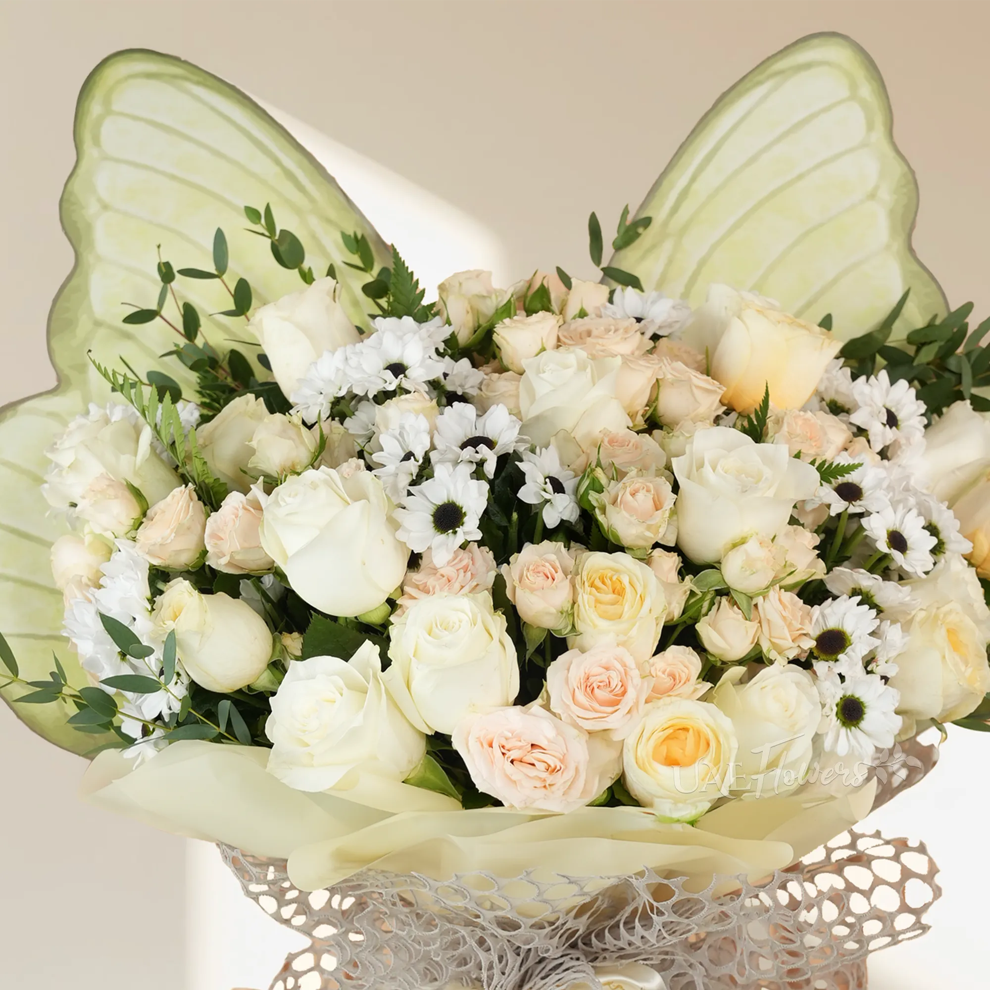 butterfly-shaped bouquet with 8 white roses, 8 pink roses, 4 pink gerberas