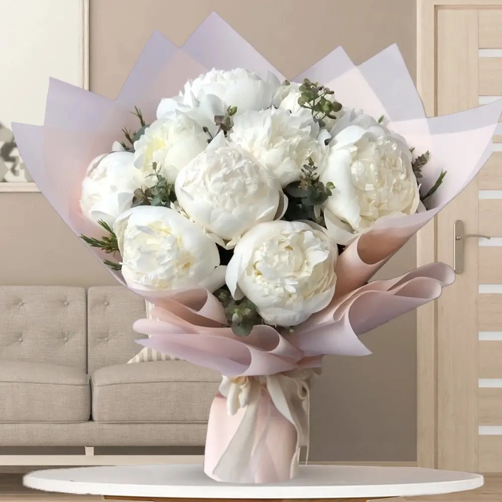 10 white peonies with fillers in pink paper with ribbons