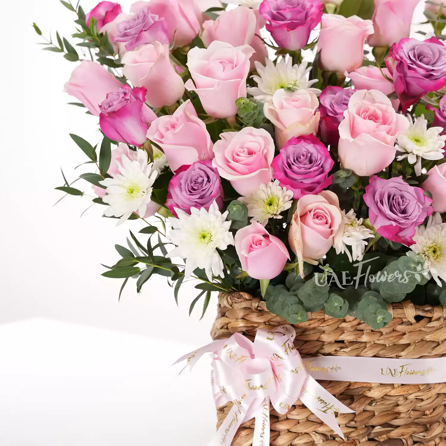 Basket Arrangement featuring 40 purple and pink roses
