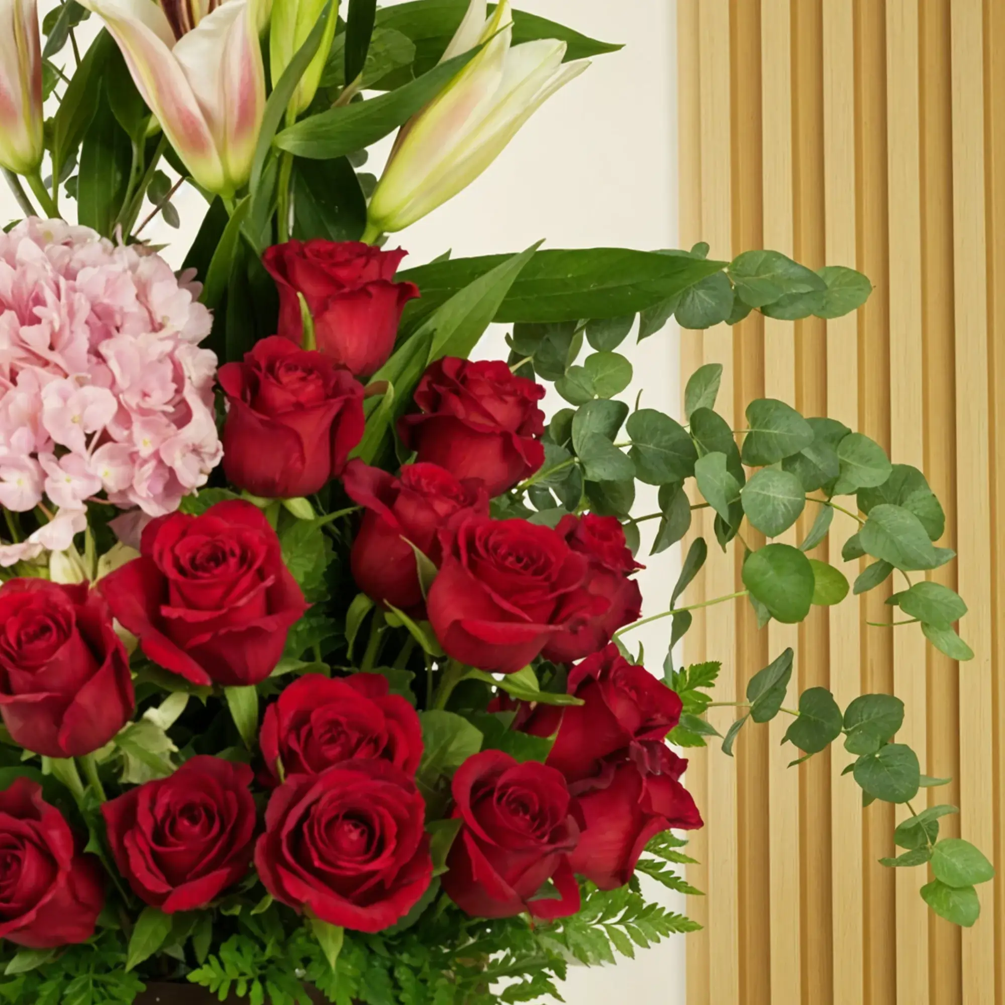 2 pink hydrangeas, 2 pink lilies, 2 white alstroemerias, 15 red roses