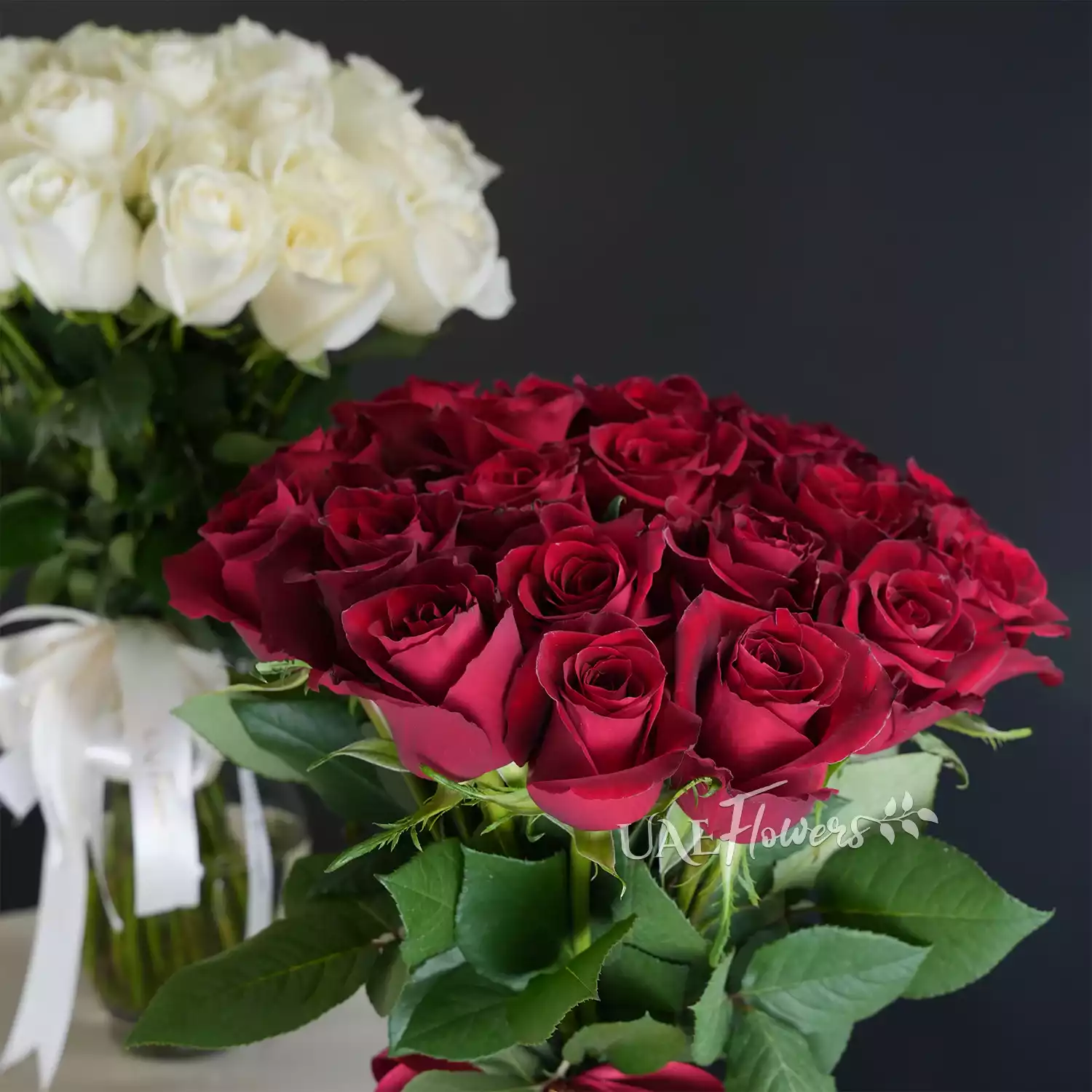 twin vases of 40 red & 40 white roses with fillers