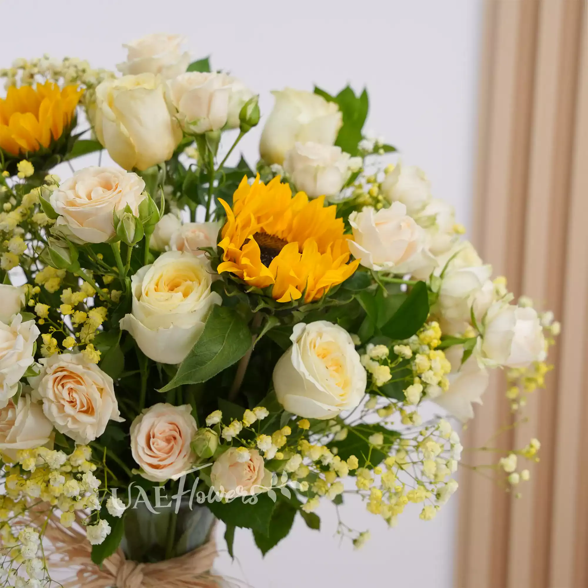 10 peach roses, 6 peach spray roses, 2 sunflowers