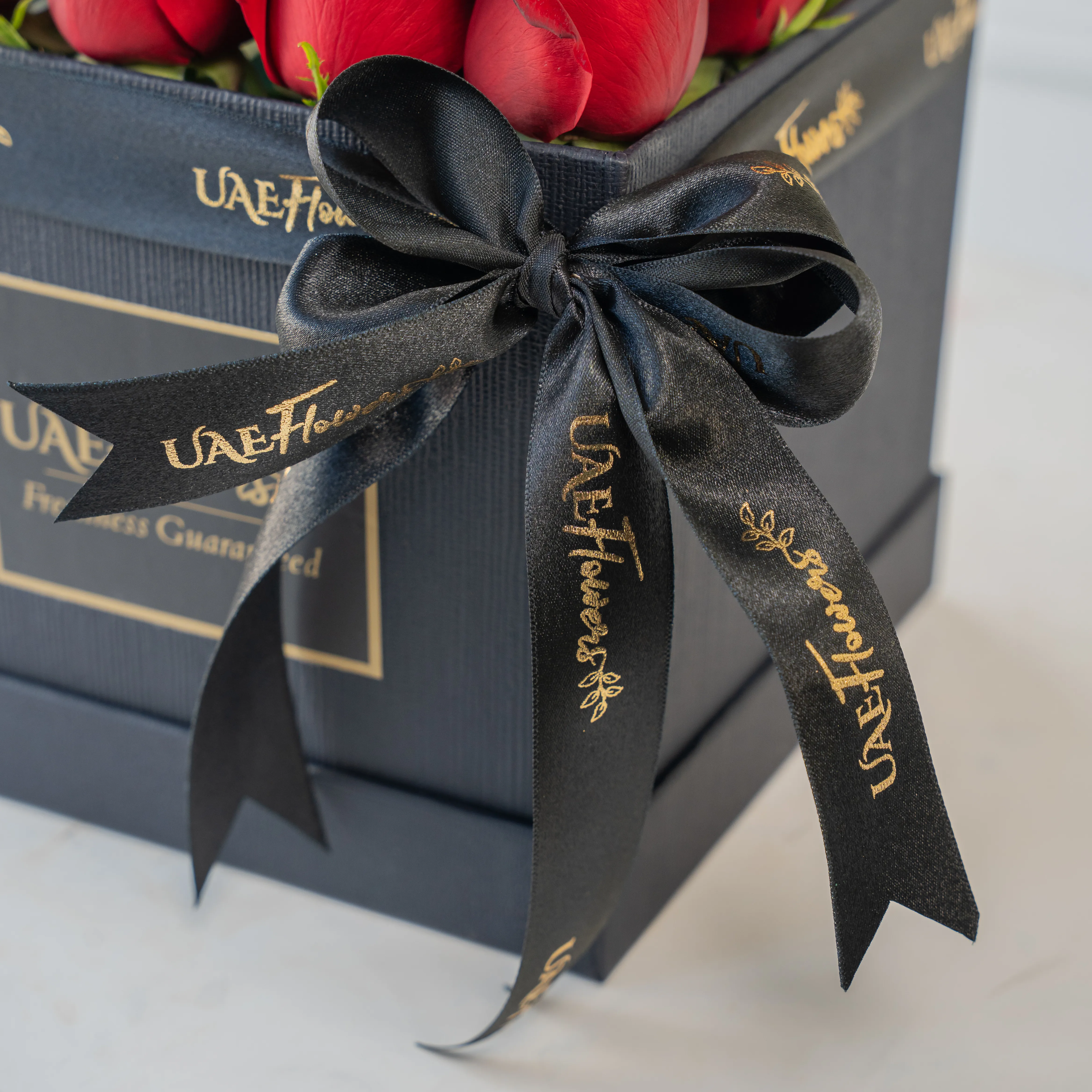 20 red roses in a round box.