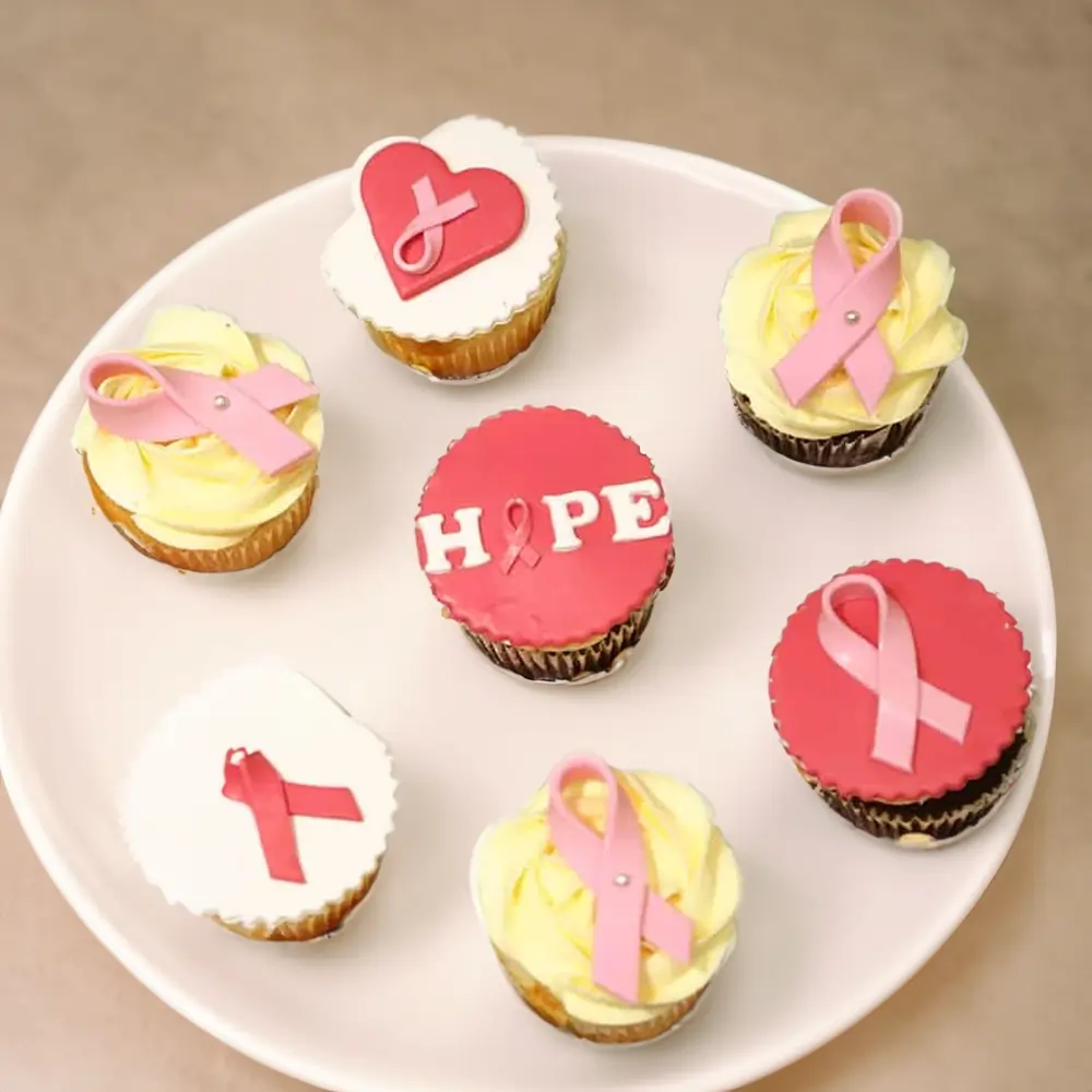 7 Pink October themed Hope cupcakes
