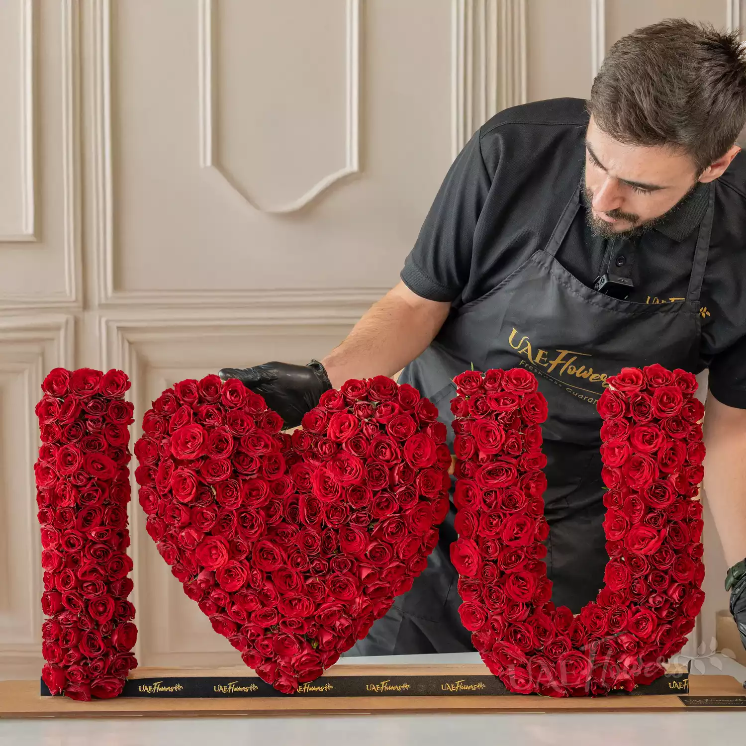 350 red spray rose buds arranged in an I Love You shape