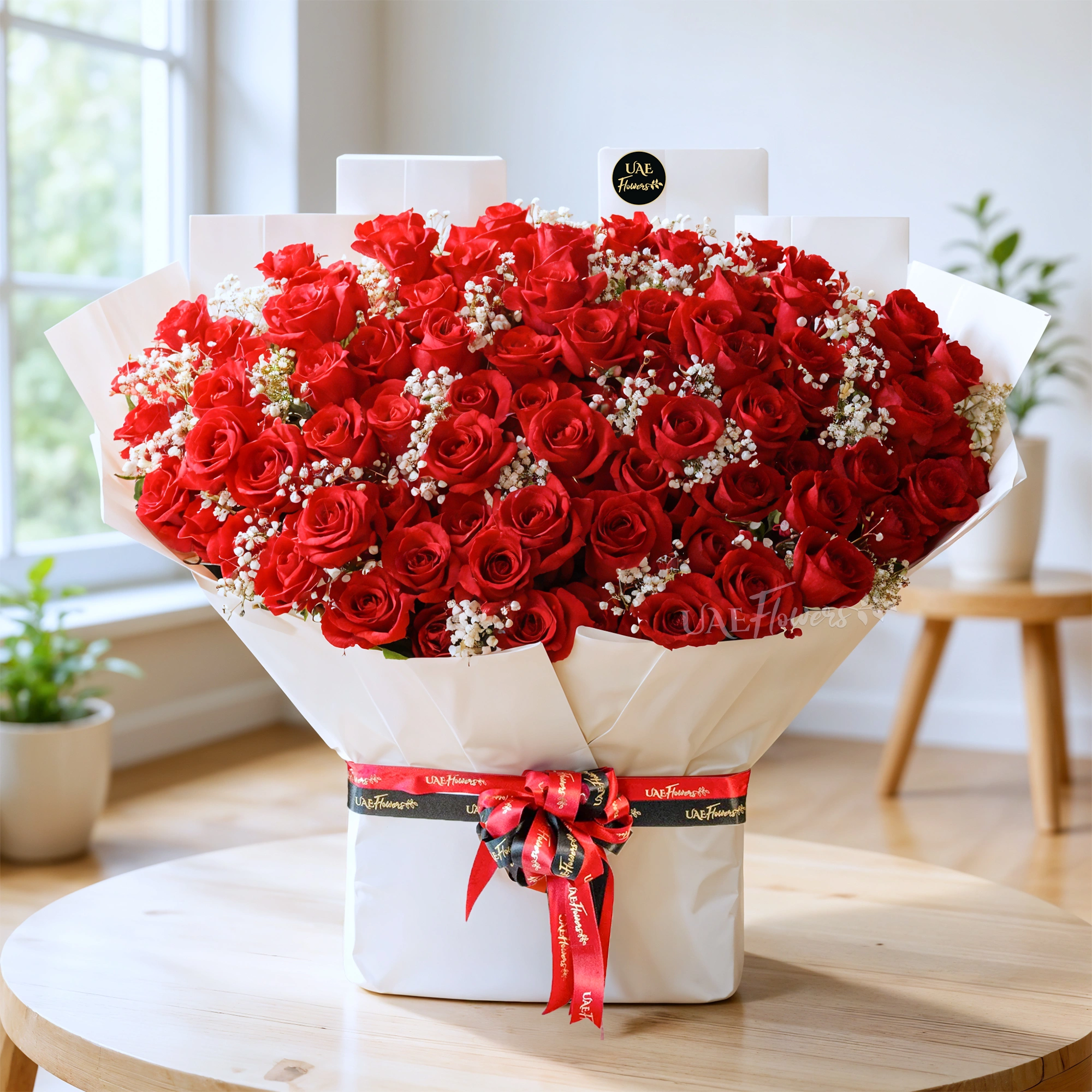 Bouquet of of 100 red roses with baby’s breath