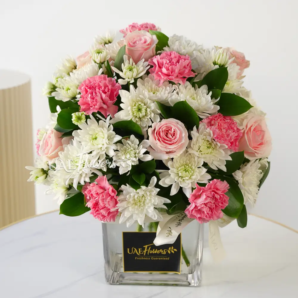 pink carnations, pink roses, and white chrysanthemums