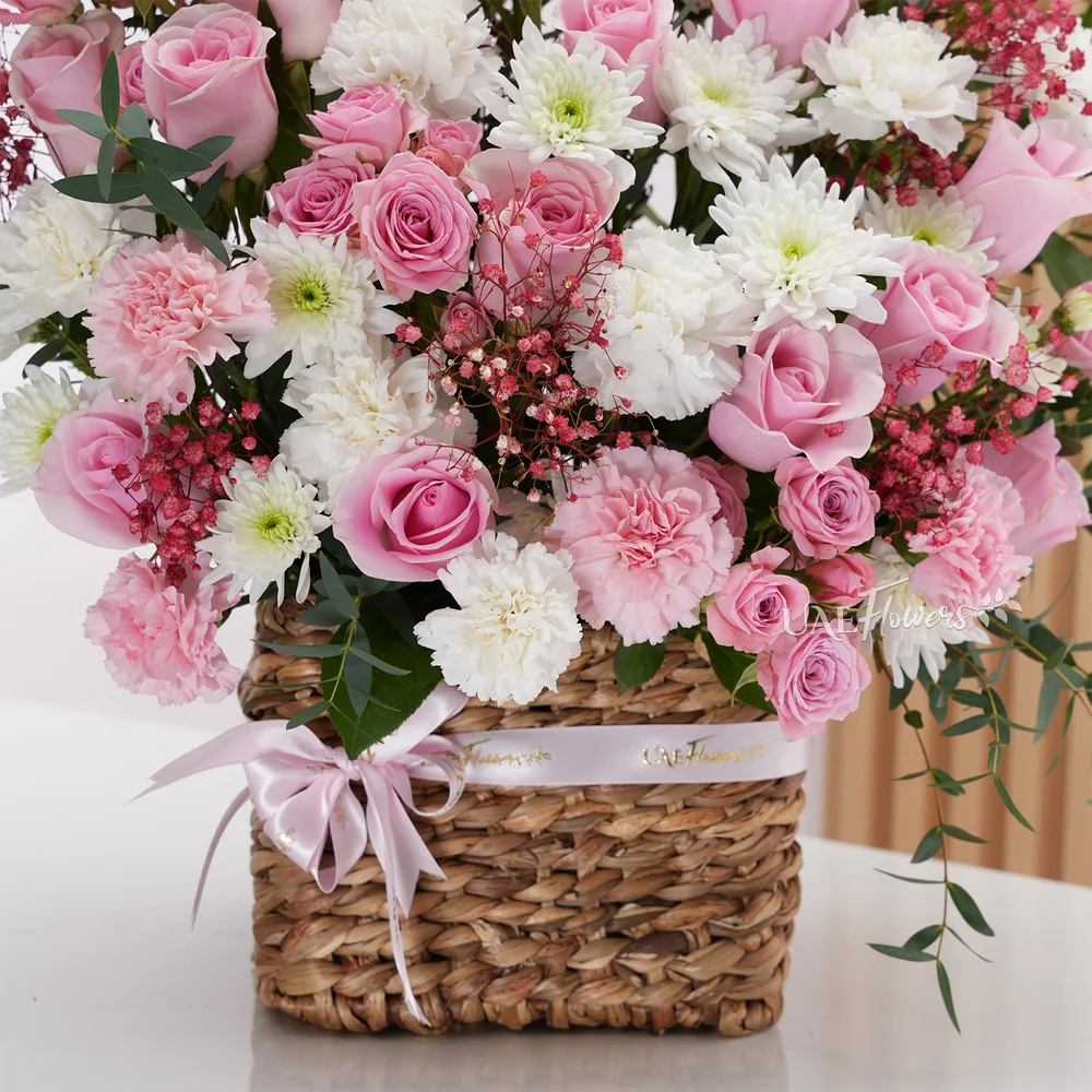 15 pink roses, 12 pink and white carnations, 5 pink spray roses,