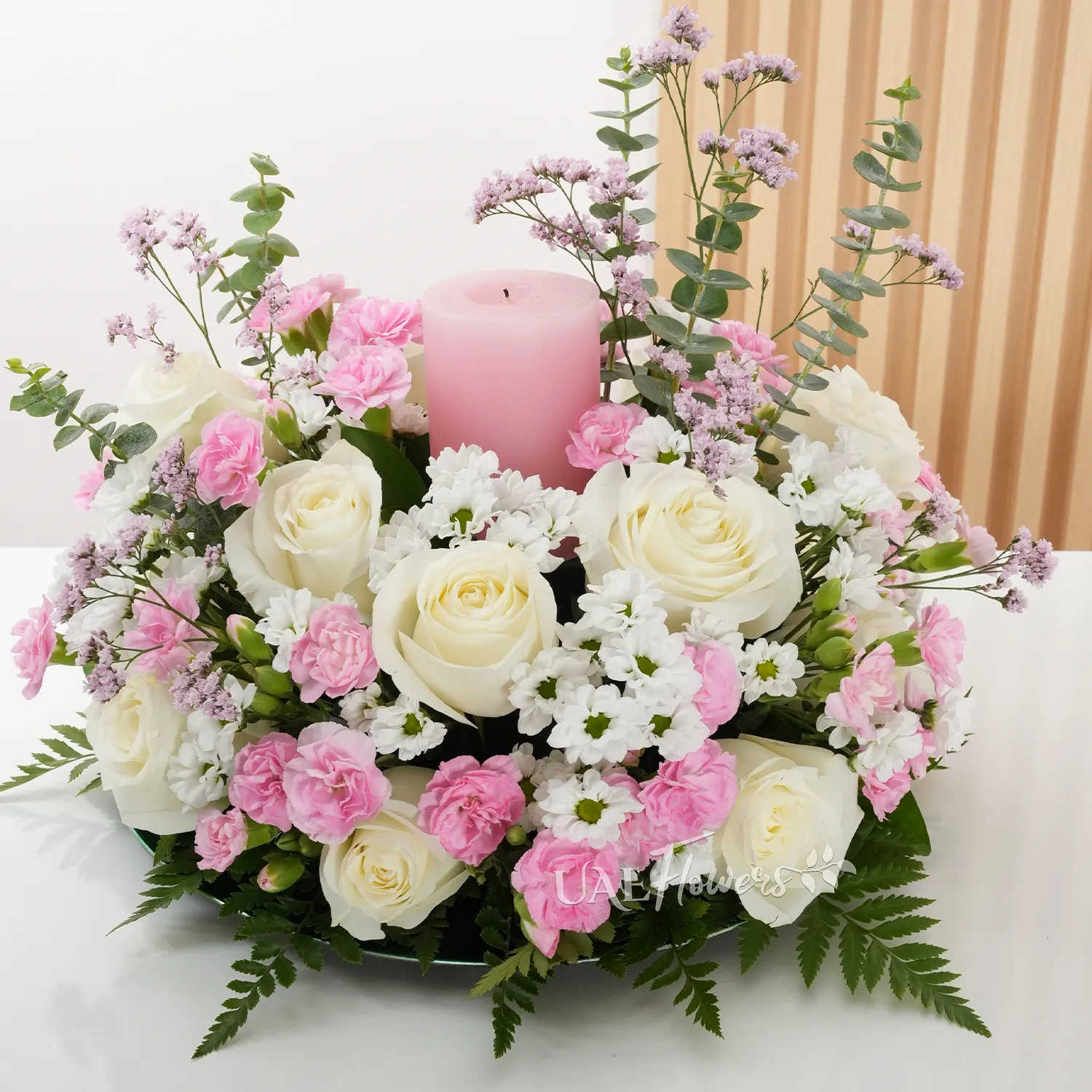 15 white roses, 5 chrysanthemums, 10 pink carnations, and pink candle