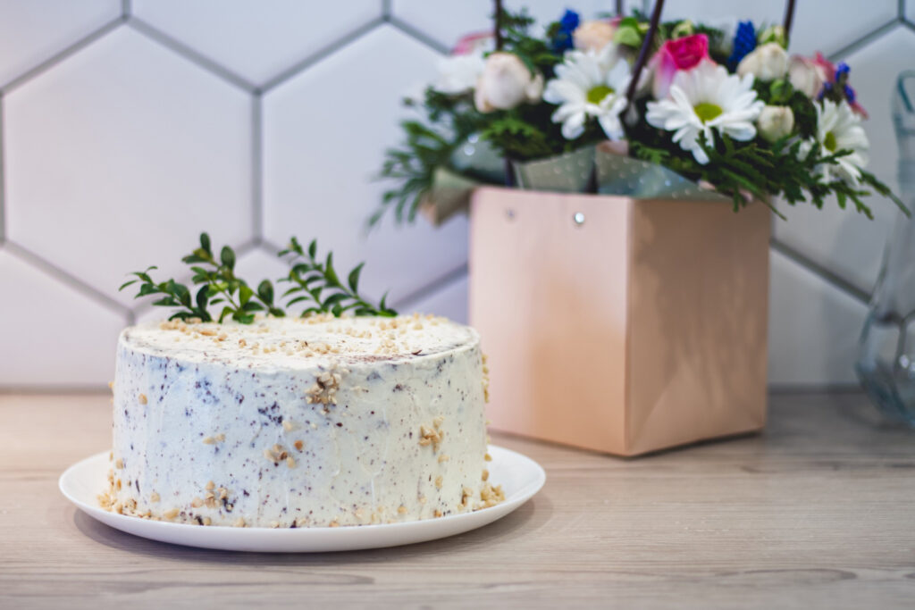 Flower and Cakes on a table are the Unique Gifts Ideas for July Born